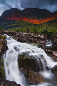 Waterfall at sunset . glencoe , scotland