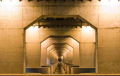 People walking in corridor of building