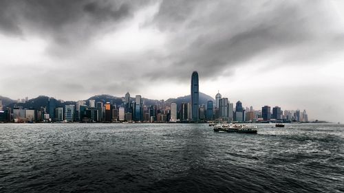 City skyline against cloudy sky