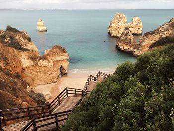 High angle view of rock formation by sea