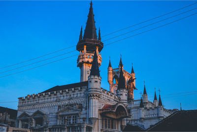 Low angle view of building against blue sky