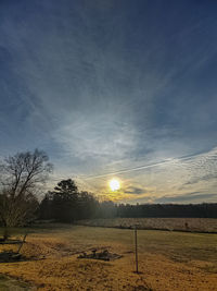 Scenic view of field against sky during sunset