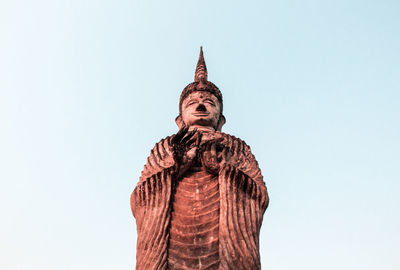 Low angle view of statue of temple against clear sky