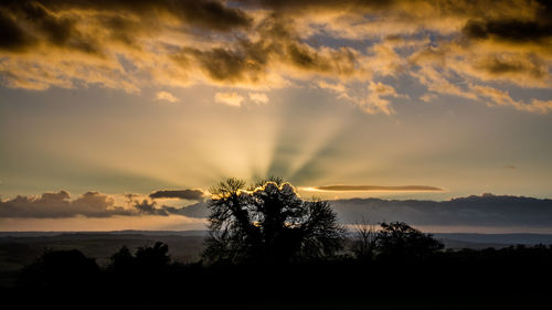 Scenic view of landscape against cloudy sky