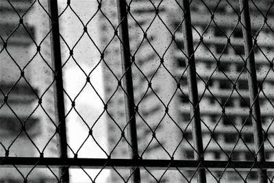 Full frame shot of chainlink fence against sky