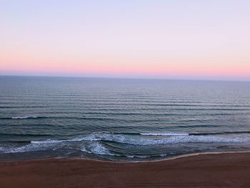 Scenic view of sea against sky at sunset