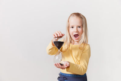 Portrait of a smiling girl over white background