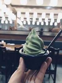 Close-up of hand holding ice cream