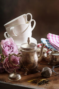 Close-up of tea kettle on table