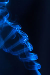 Close-up of smoke against black background