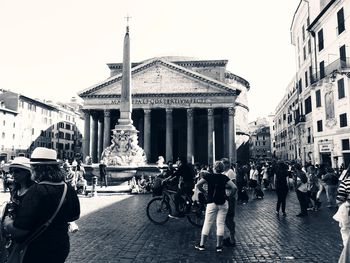 People walking on street in city
