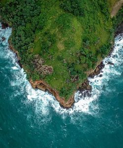 High angle view of cliff by sea