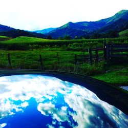 Scenic view of landscape and mountains against sky