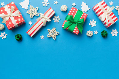 Directly above shot of christmas decorations on blue background