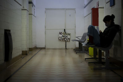 Man sitting on chair in building