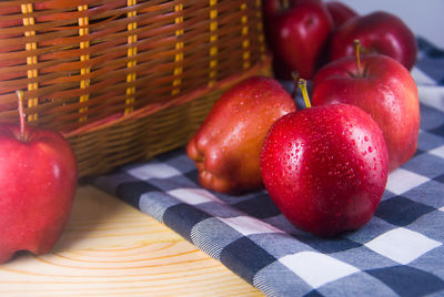 Close-up of apples in basket on table