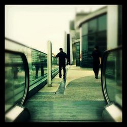 Rear view of woman walking in city