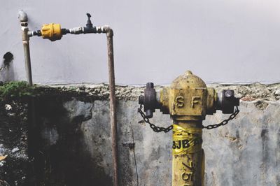 Close-up of fire hydrant against sky