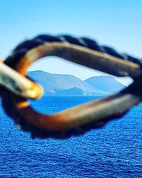 Close-up of sea against clear blue sky