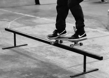 Low section of man standing on skateboard