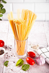 Italian pasta ingredients on kitchen table. food cooking