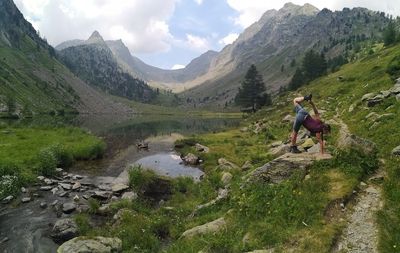 Woman exercising on rock 