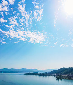 Scenic view of lake against blue sky