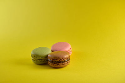 Close-up of dessert against yellow background