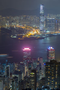 High angle view of illuminated city buildings at night