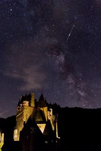 Low angle view of building against sky at night