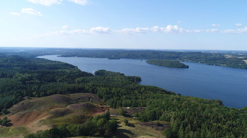 High angle view of trees and sea against sky