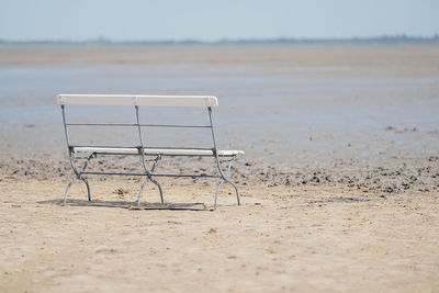 Wooden bench on beach