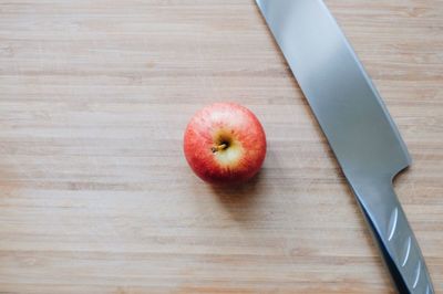 High angle view of apple on cutting board