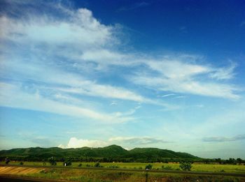 Scenic view of landscape against cloudy sky
