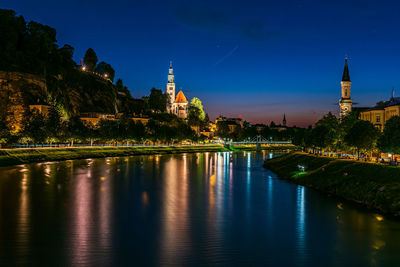 Illuminated buildings at waterfront