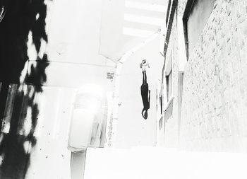 Man hanging on wall