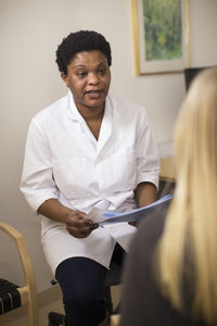 Doctor talking with patient