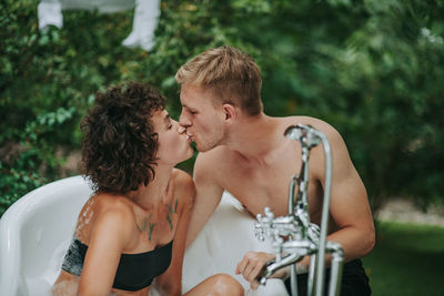 Young couple kissing outdoors