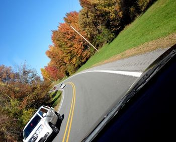 Cropped image of car on road