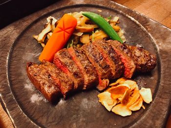 High angle view of meat on barbecue grill