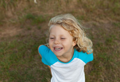 Portrait of smiling girl on field