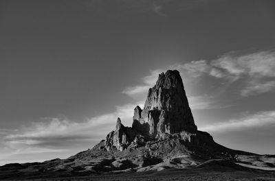 Low angle view of rock formations against sky