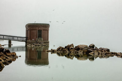 Foggy detroit river rocks and jetty