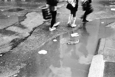 Low section of man in puddle