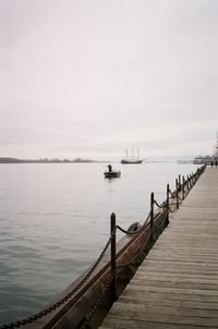 Pier over sea against sky