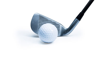 Close-up of ball on table against white background