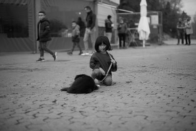 Full length of woman on street in city