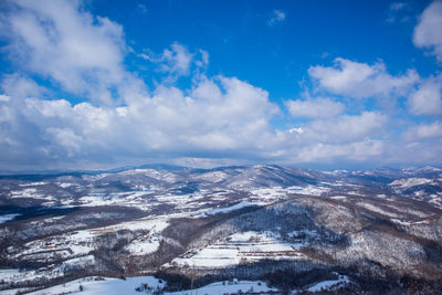 Aerial view of valley against sky