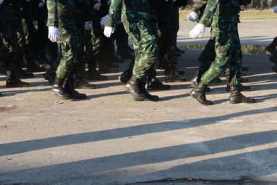 Low section of soldiers standing on street