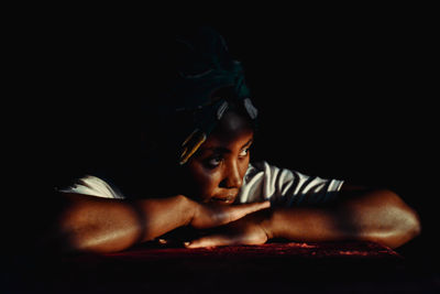 Thoughtful woman leaning on table